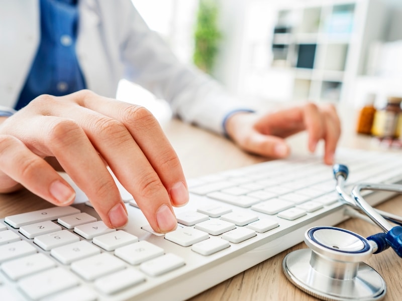 Image of a doctor doing research on his computer